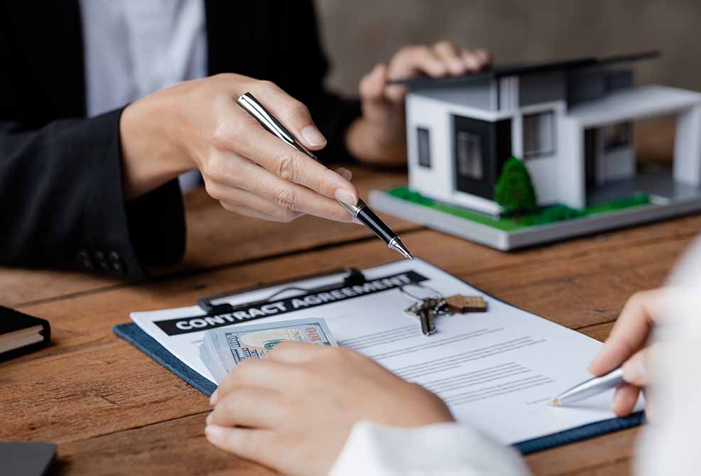 people overlooking a contract agreement